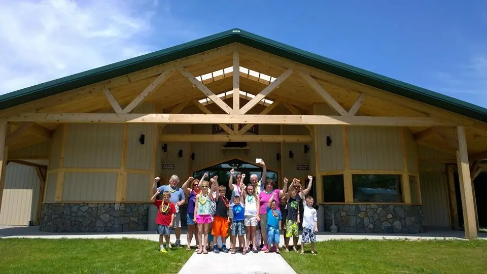 group celebrating in front of building