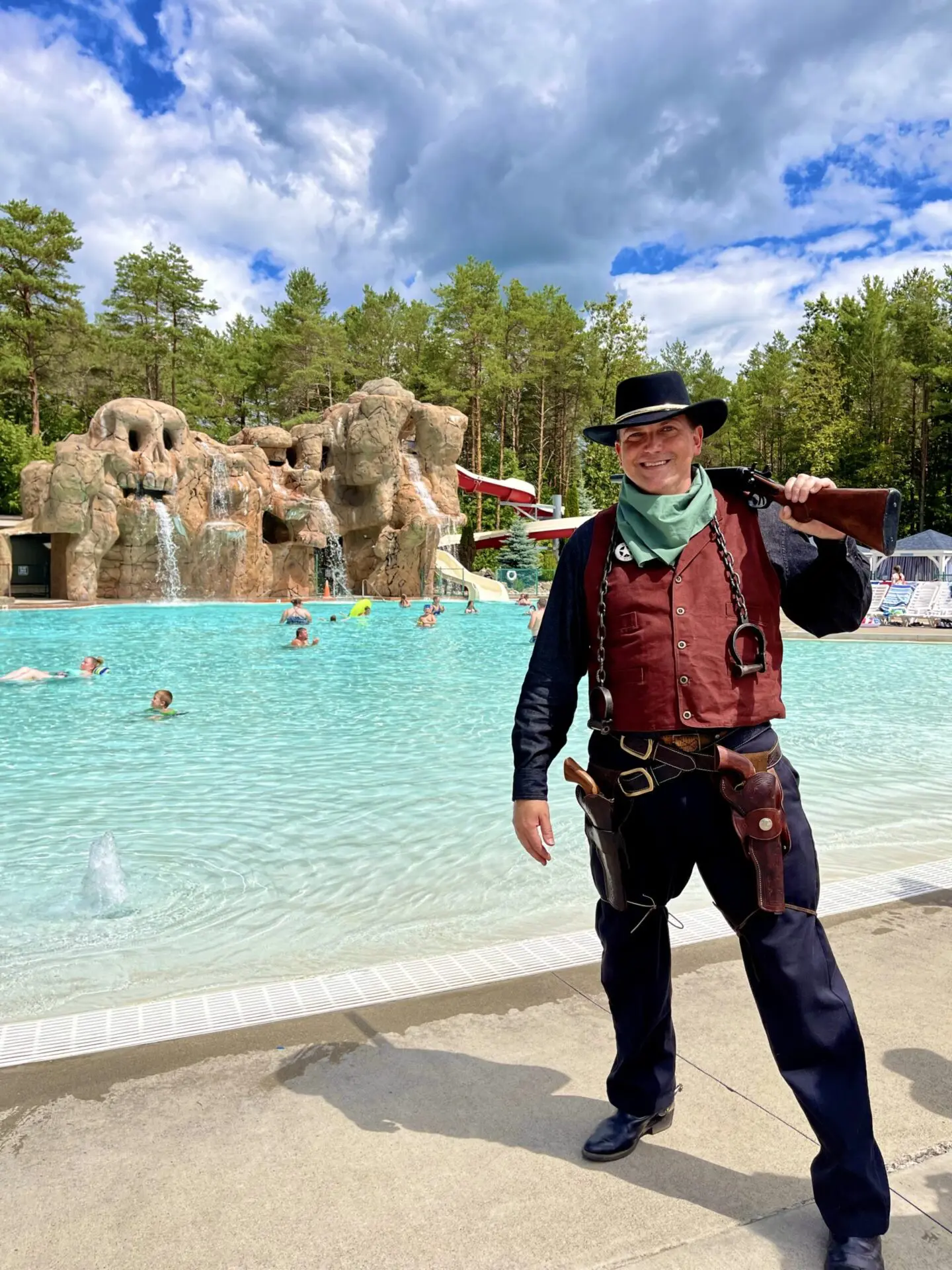 Western cowboy standing by pool