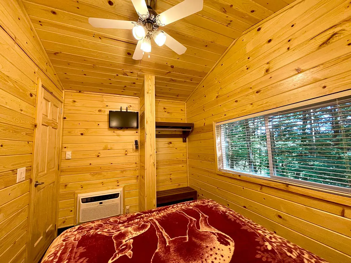 Deluxe Cabin bedroom with ac and wall mounted tv