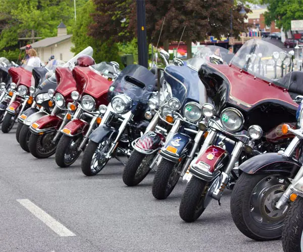 Motorcycles lined up on street